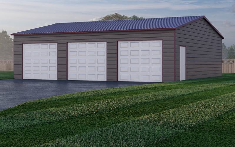 Gray 30 by 40 foot metal garage with three white overhead doors and a walk-in door