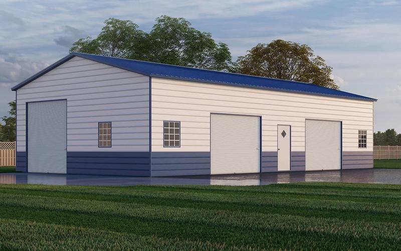 White and blue 30 by 50 foot metal garage with three roll-up doors and five windows