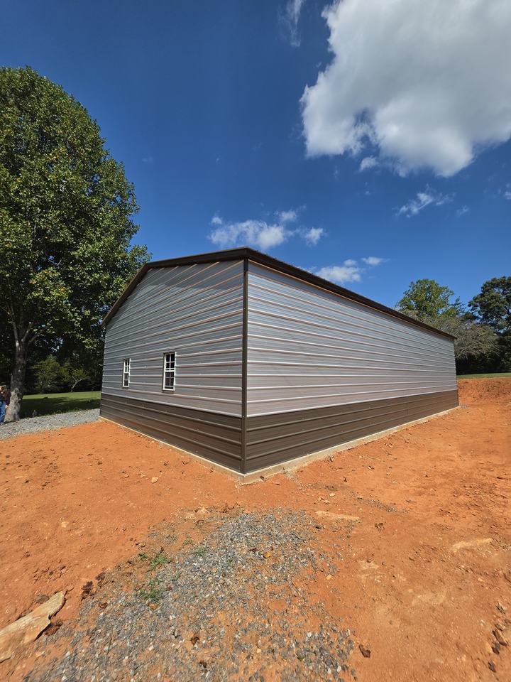 Rear corner of the finished garage showing the straight concrete slab edge