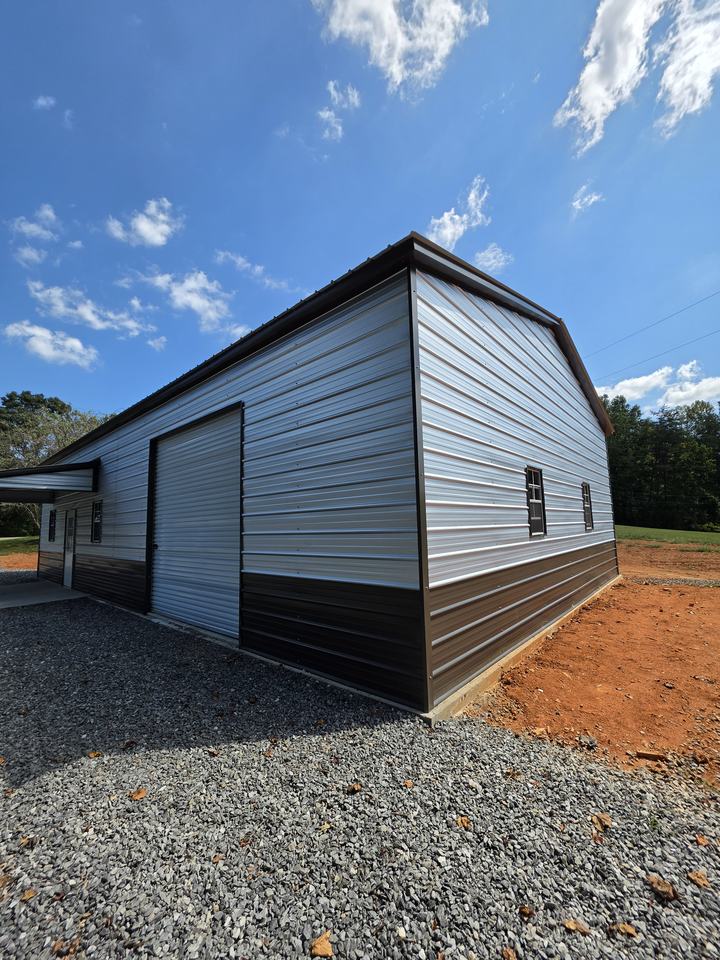 Corner view of the finished garage showing the roll-up door and two-tone wall panels